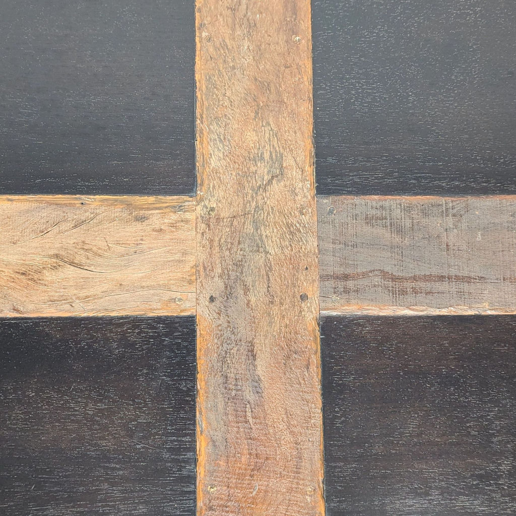 2. Close-up of the Reperch dining table surface, highlighting the intersecting natural wood inlay detail.