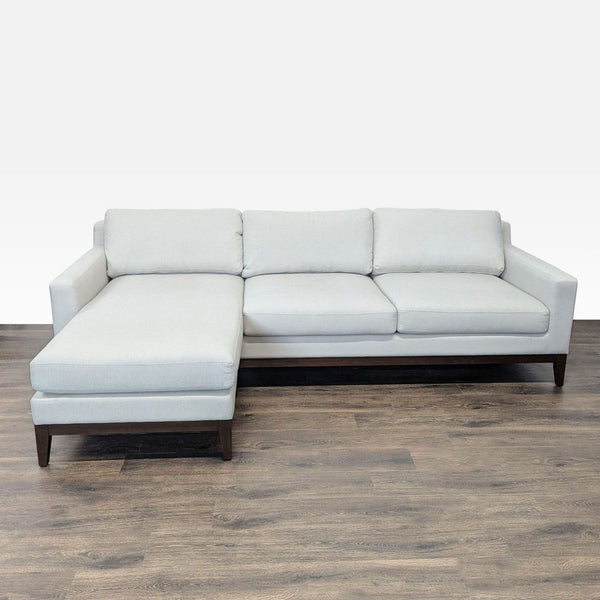 Poly & Bark sectional sofa with left-side chaise, gray fabric upholstery, and wooden legs in a modern style.