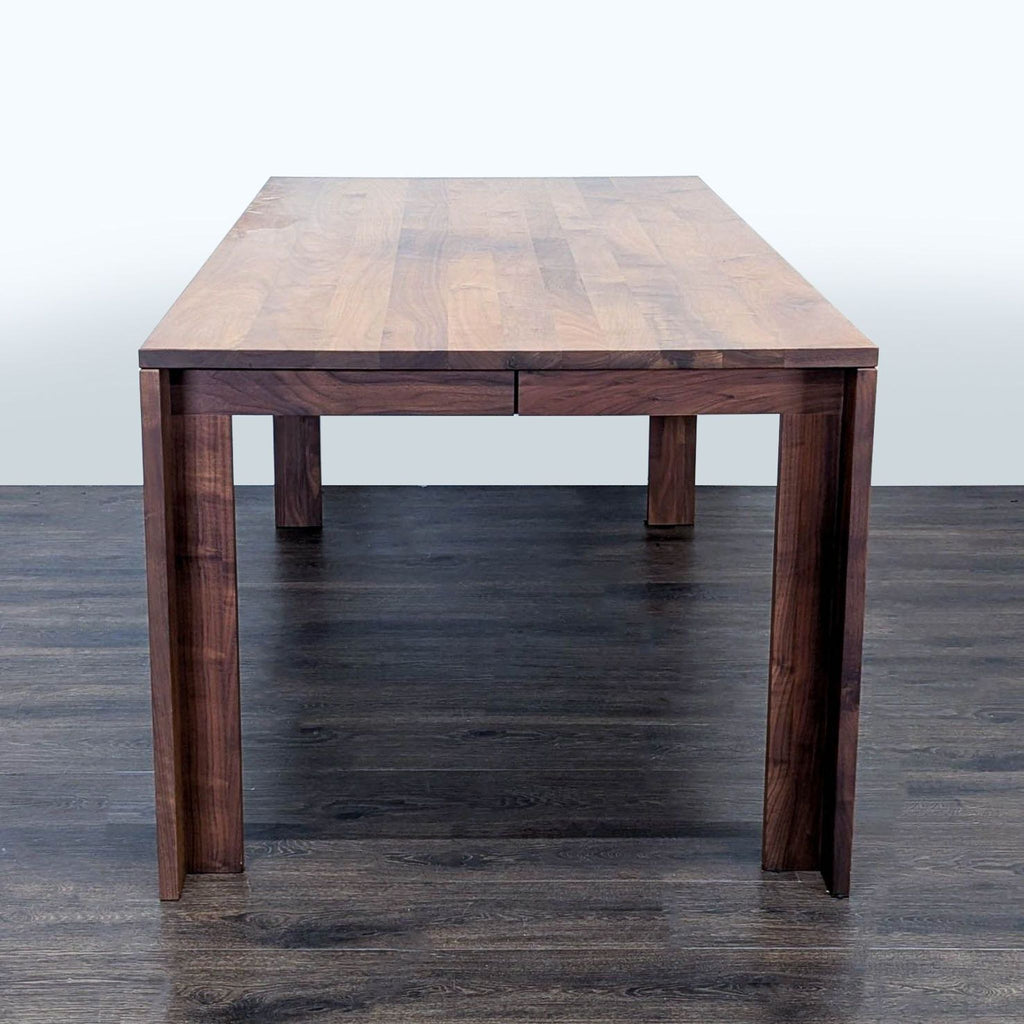 3. Sleek walnut dining table, designed by Vincent Chia for Design Within Reach, with classic, timeless form.