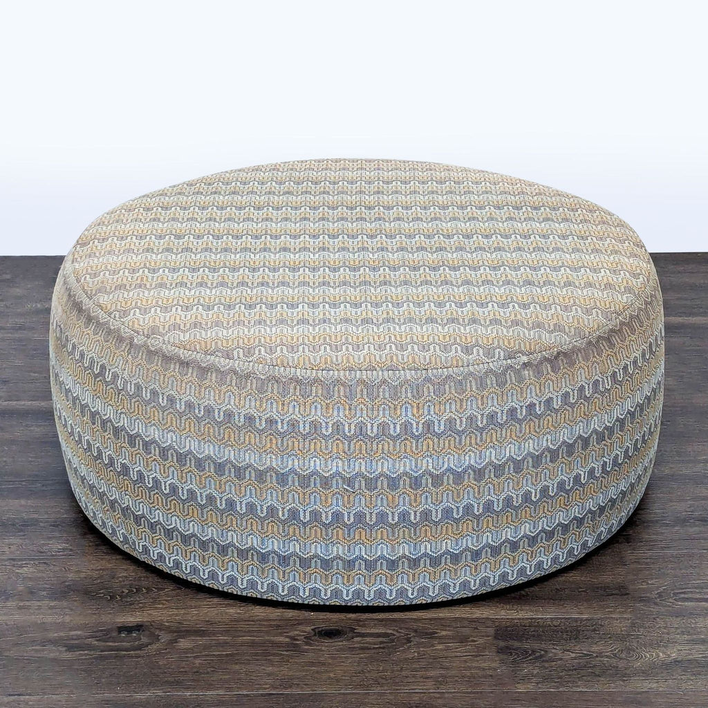 Room & Board circular ottoman with textured stripes in earth tones, designed for Stools, Ottomans & Benches.