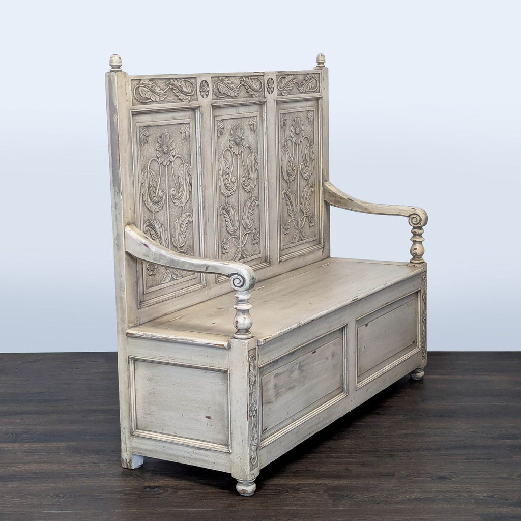 2. Angled view of a Reperch bench showing intricate carved details, scrolled armrests, and sturdy wooden construction.