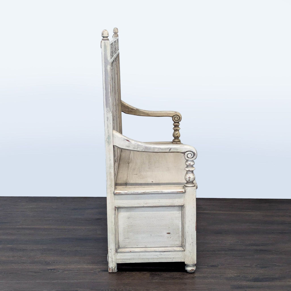 3. Side profile of the Reperch bench highlighting armrest carvings and distressed wood paneling, ottoman-bench style.