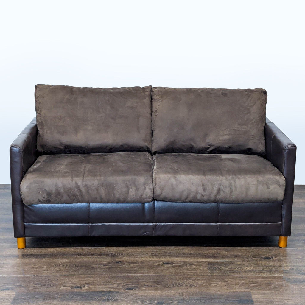 1. Front view of a Reperch Sleeper Sofa with plush brown cushions and dark arms on wooden legs.
