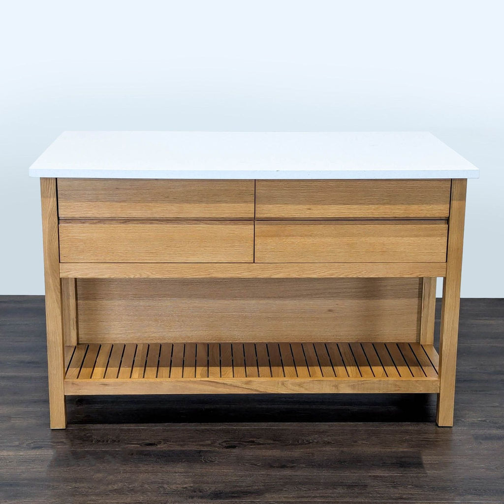 1. Article dining table with a white top, wooden frame, and lower slatted shelf, shown from the front view.