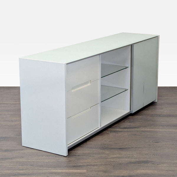 1. Modern white Reperch dresser with two drawers, glass shelves, and a closed cabinet, shown in angled view.