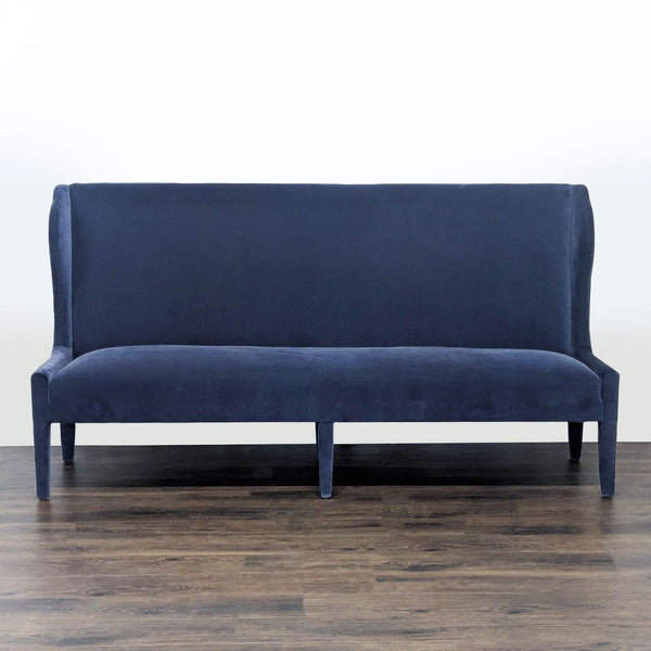 1. Verellen brand bench with high back, upholstered in dark blue fabric, shown on a wood floor, front view.