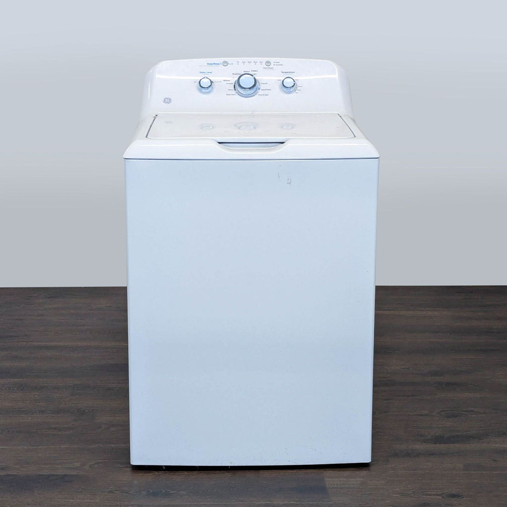GE top load washer with classic white finish, spacious drum, and user-friendly controls, ideal for most laundry rooms.  