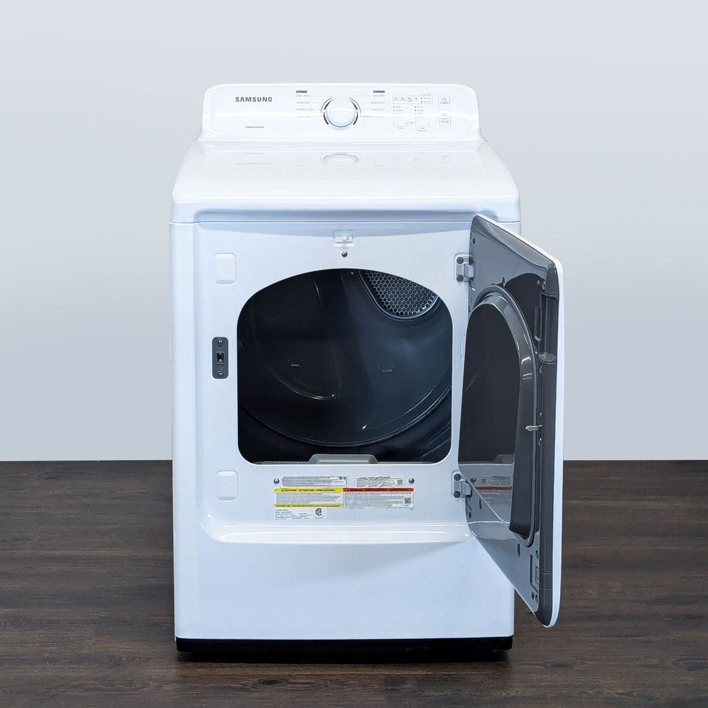 2. Samsung washer/dryer appliance with the front door open, revealing the spacious interior drum.  