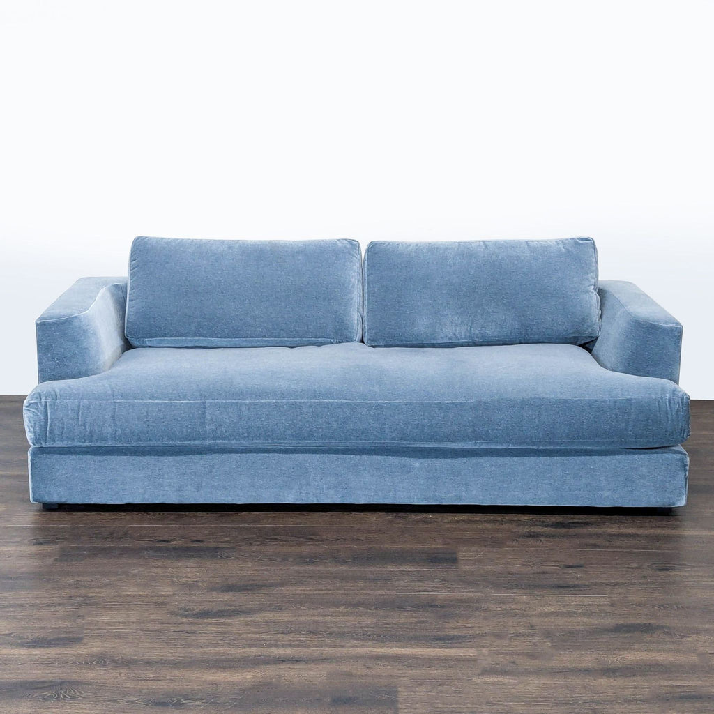 1. Front view of a blue Maiden Home 3-seat sofa with plush cushions on a dark wood floor.