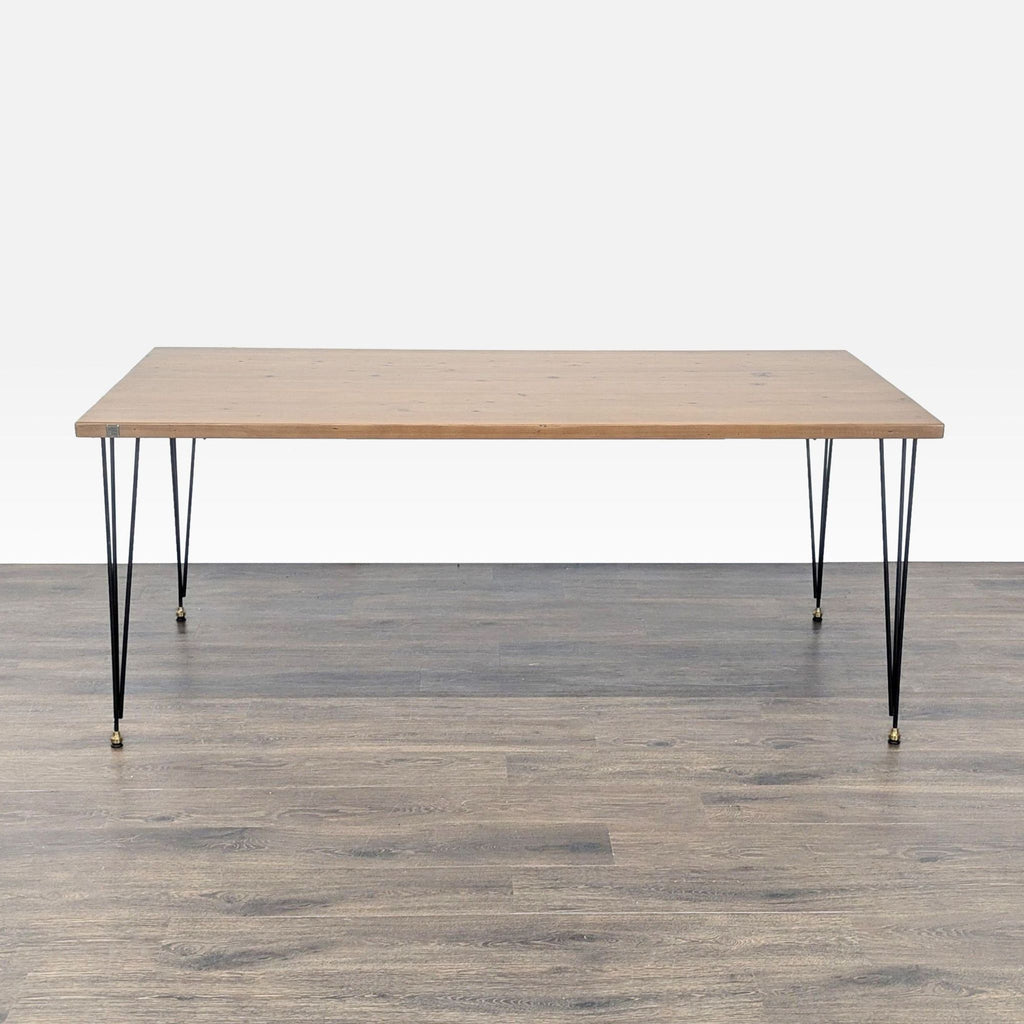 1. Urban Wood Goods dining table with a rectangular wood top and minimalist black hairpin legs, viewed from the front.