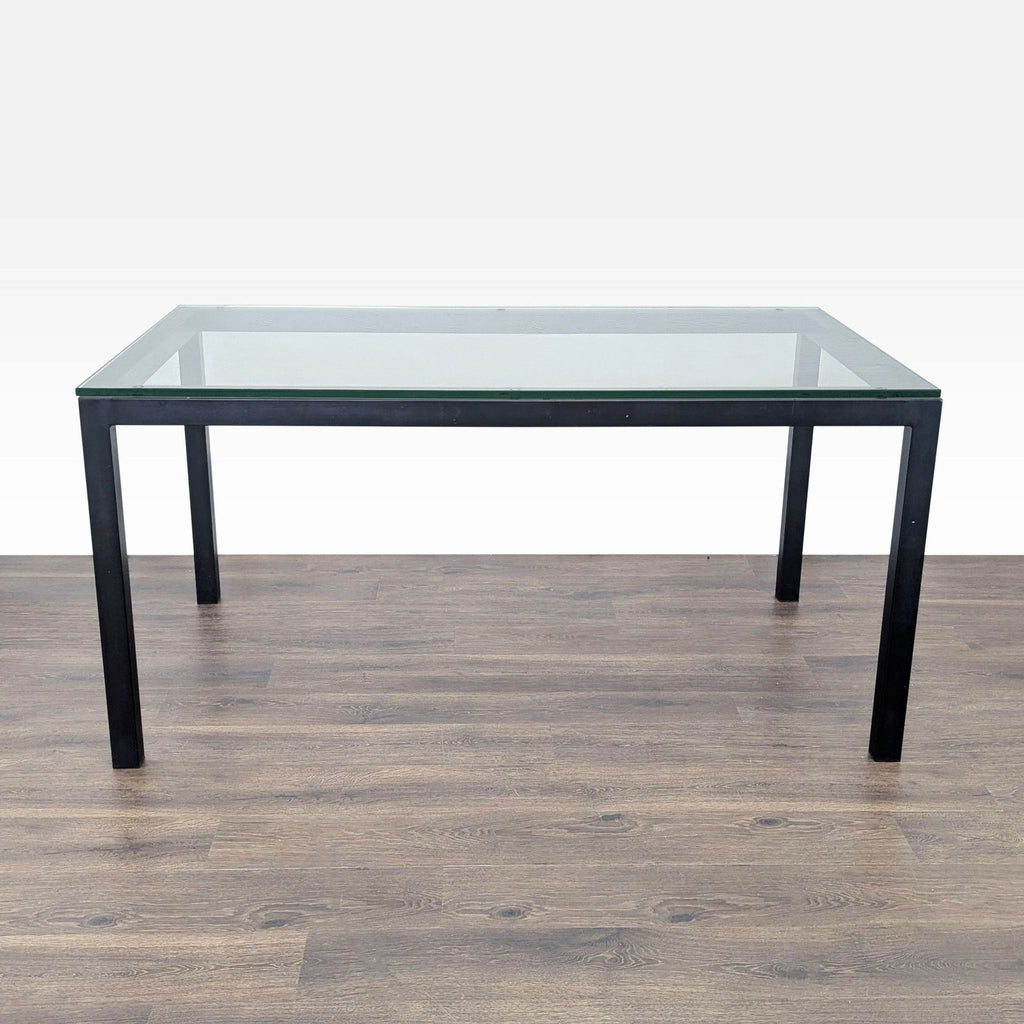 Crate & Barrel dining table with a powder coated steel base, modern design.  