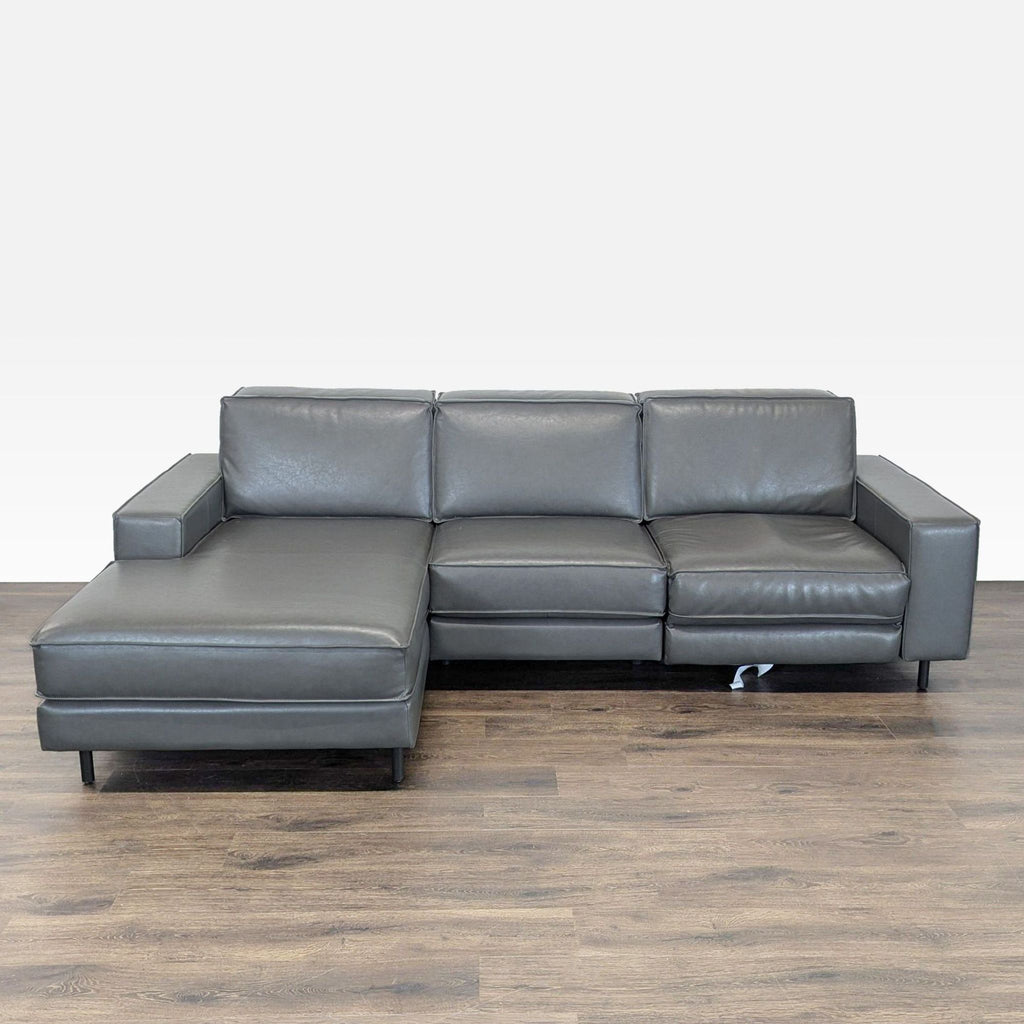 West Elm gray leather sectional with left chaise and right power recliner, featuring modern, clean-lined design.  