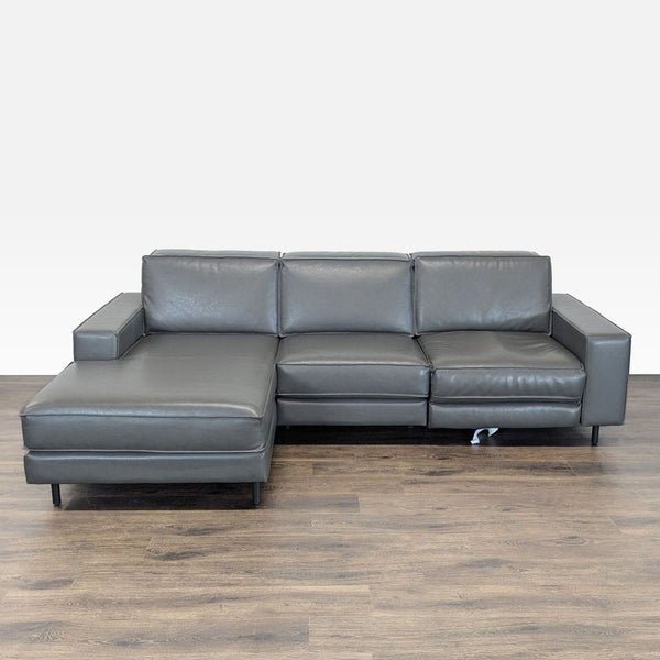 West Elm gray leather sectional with left chaise and right-side power recliner, modern and spacious.  