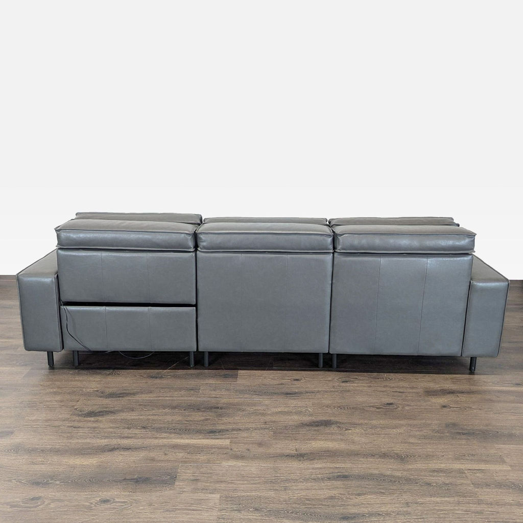 Contemporary West Elm sofa with gray leather finish, left chaise lounge, and right power recliner for comfort.