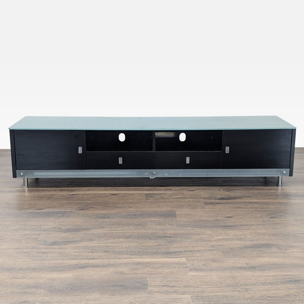 1. Entertainment center featuring a sleek green glass top surface.