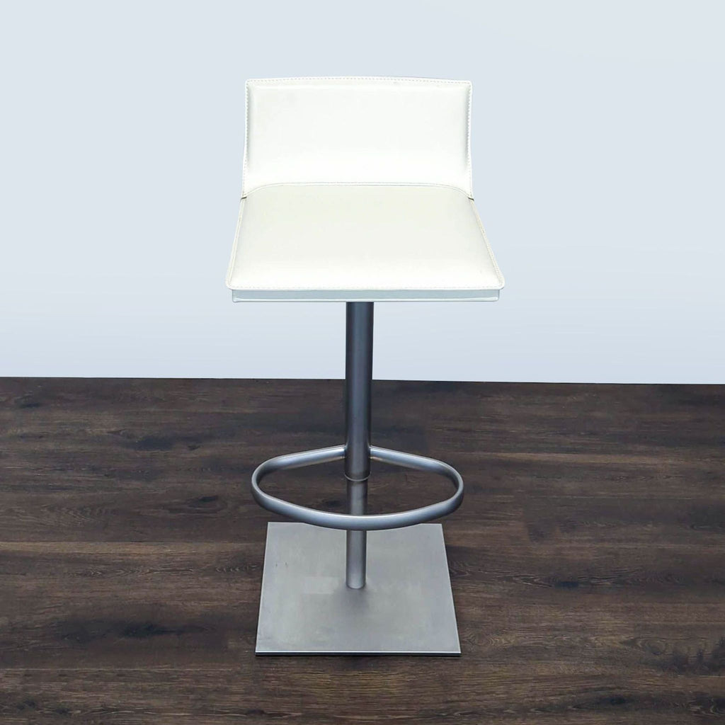 Hand-sewn, stain-resistant leather bar stool from Design Within Reach, featuring 360-degree swivel.