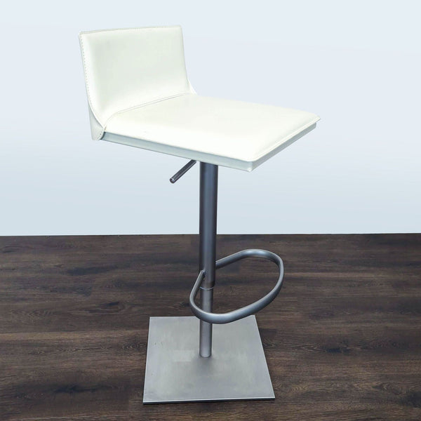 Modern leather swivel stool with height-adjustable gas piston, designed for counters or bars.