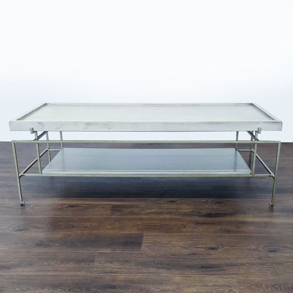 Coffee table with wood veneer top and shelf on a sturdy metal frame.  