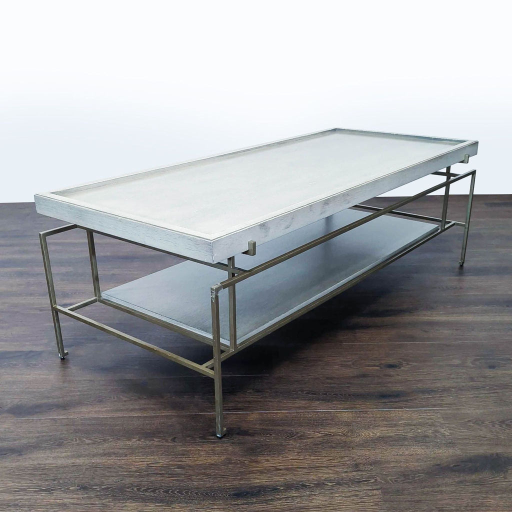 Modern coffee table featuring wood surfaces and a sleek metal structure.  