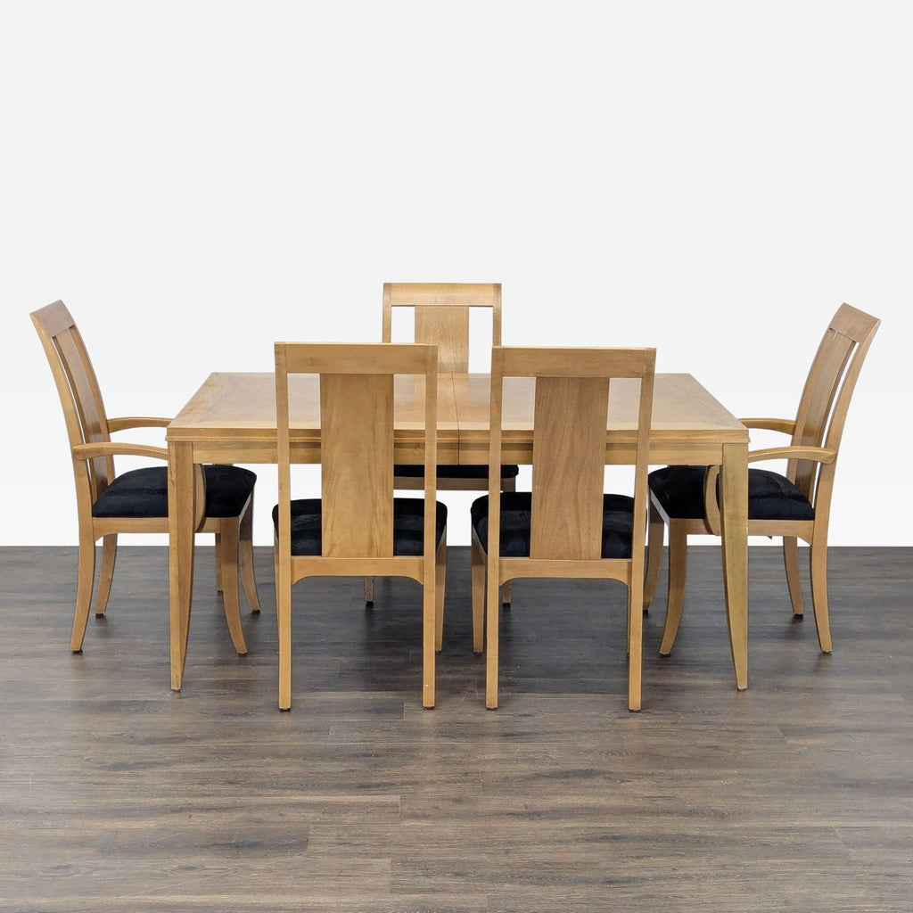 Ethan Allen dining set with expandable wood table and five chairs with black upholstered seats.  