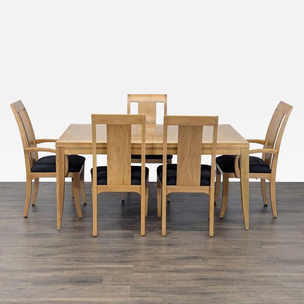 Ethan Allen dining set with expandable wood table and five chairs with black upholstered seats.  