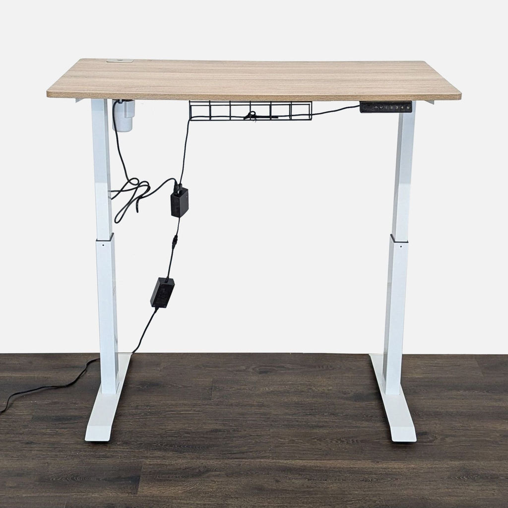 Contemporary desk with spacious wood laminate top, adjustable height, sturdy white frame, and cord organizer.