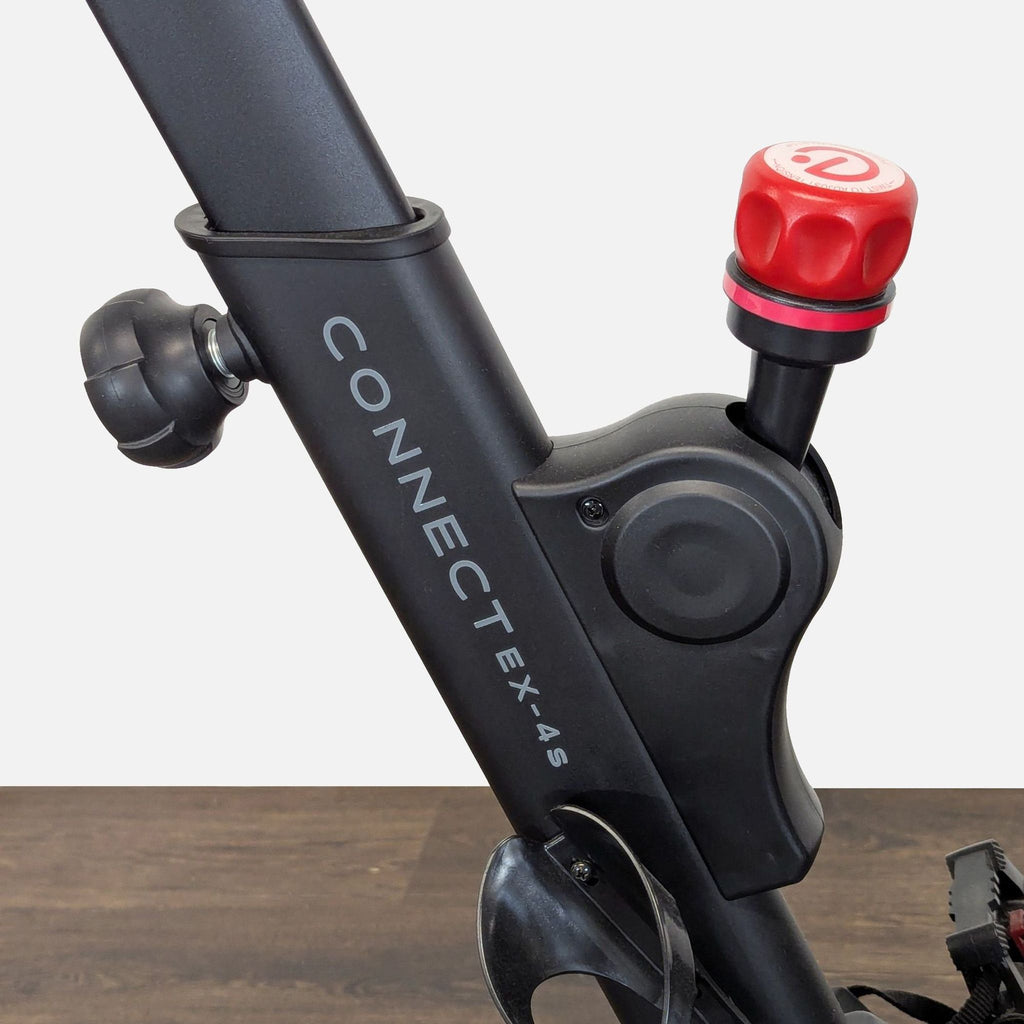 Echelon brand smart bike offering smooth rides, progress tracking, and personalized training via touchscreen controls.