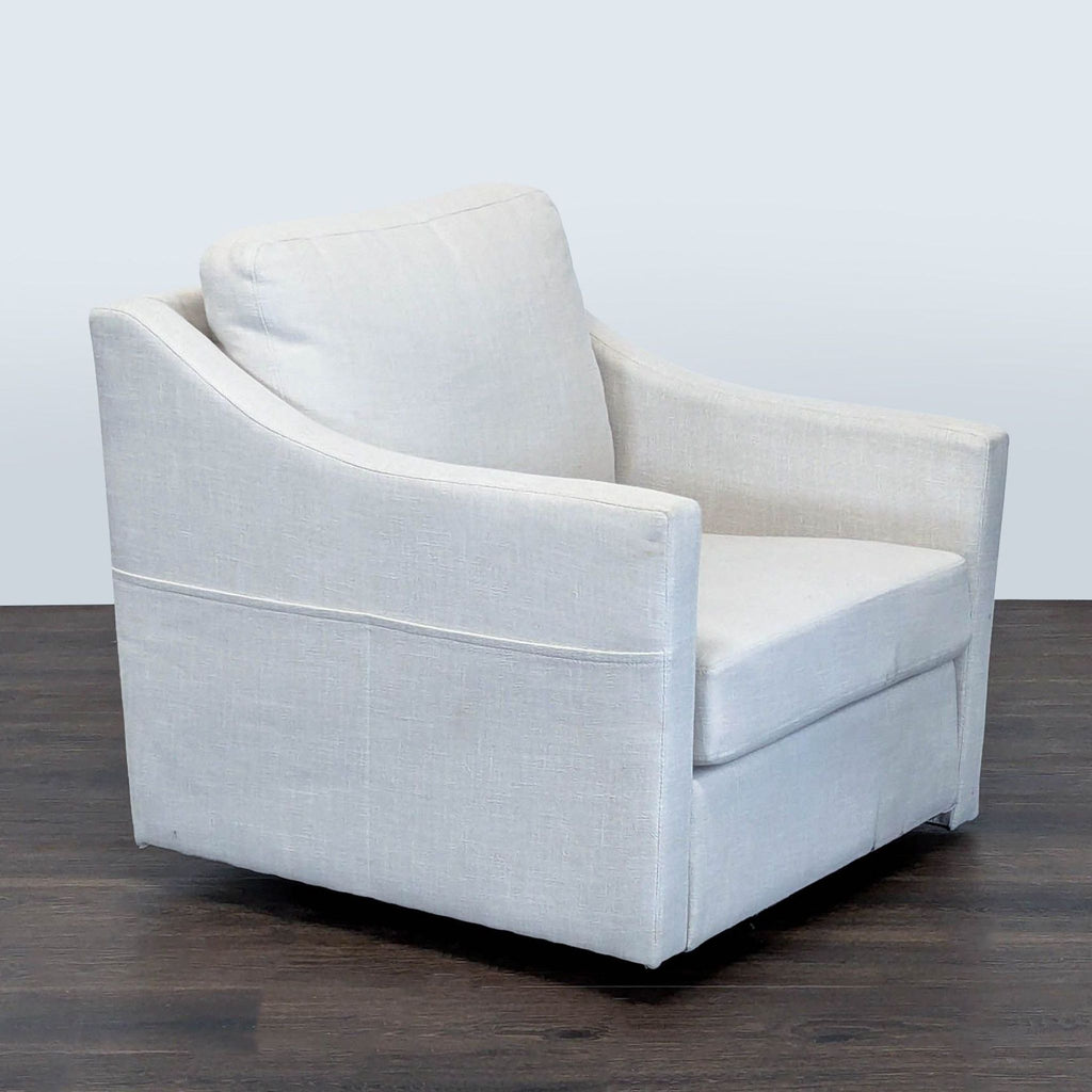 Upholstered lounge chair with gentle arm slopes, cushioned support, and a clean look, ideal for living spaces.