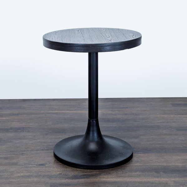 Round wood tabletop with a sleek metal tulip base, designed as a side or console table by Williams Sonoma.  