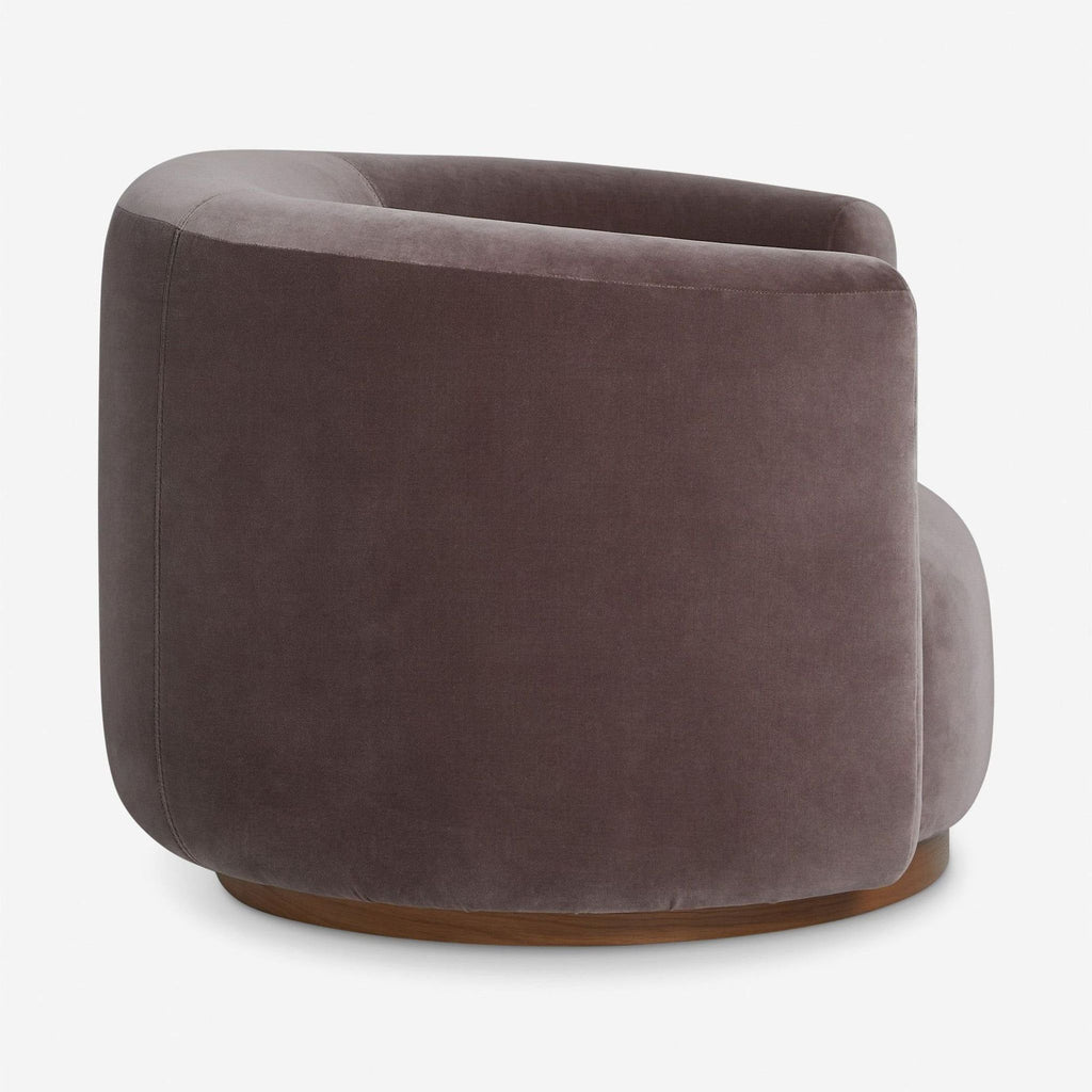 Modern lounge chair by Lulu and Georgia in rich taupe velvet, rounded design, and matching bolster pillow.
