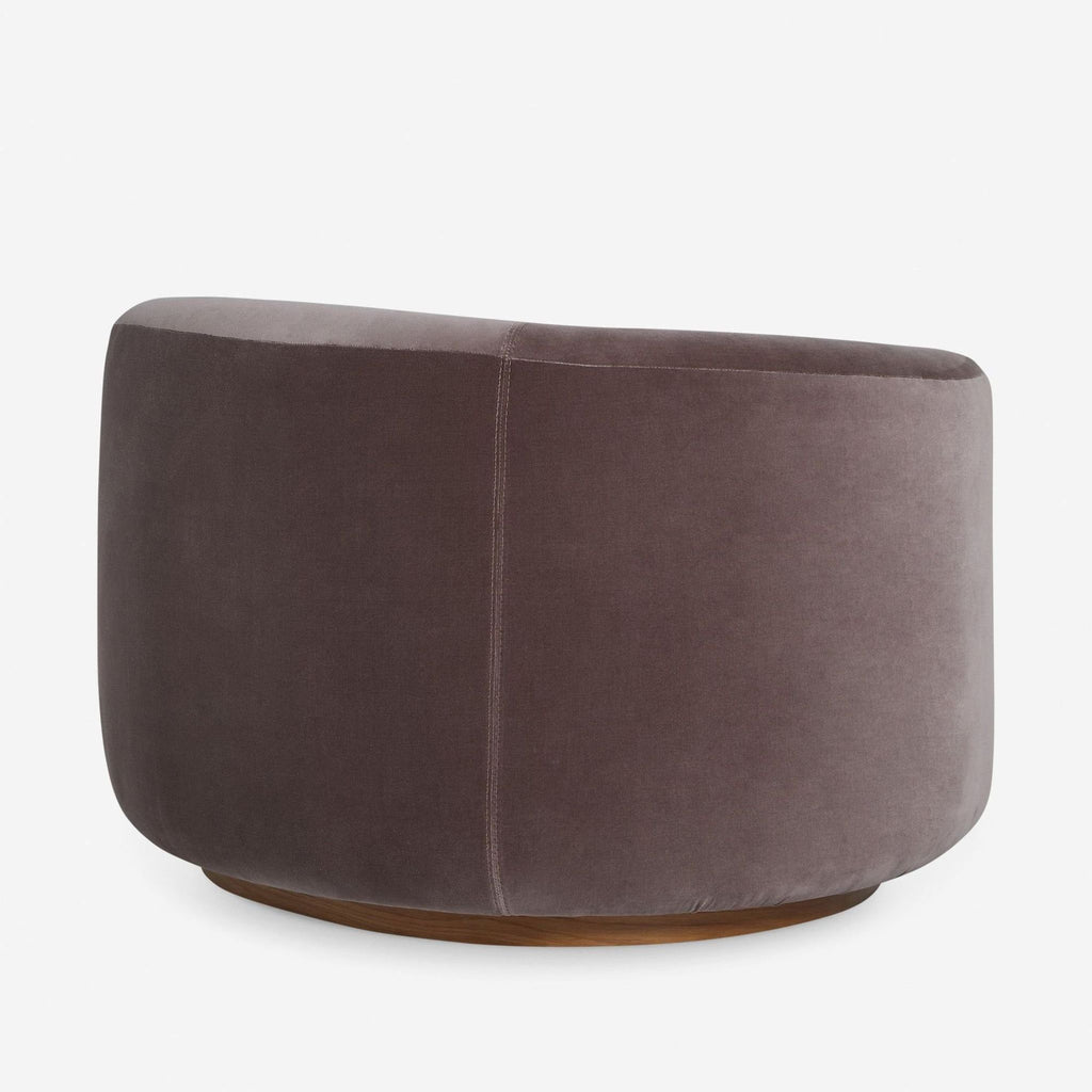 Soft velvet swivel chair from Lulu and Georgia, featuring a rounded profile and plush taupe upholstery.