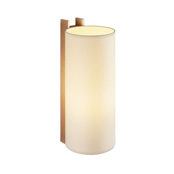 Santa & Cole wall sconce with a cylindrical white shade and wooden support, offering warm, ambient light.