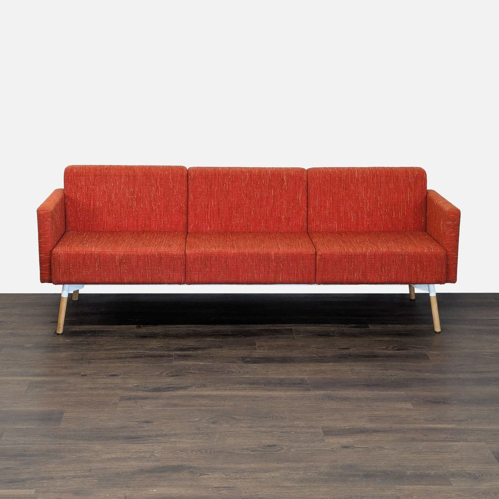 HighTower 3-seat sofa with bold upholstery, clean lines, and wooden legs; comfy and modern design.