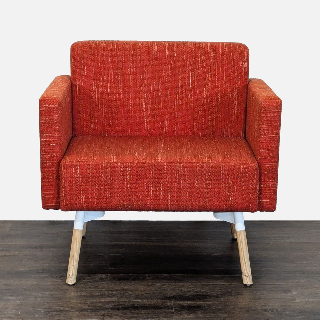 HighTower lounge chair with vibrant upholstery, wooden legs, and wide armrests in a modern design.