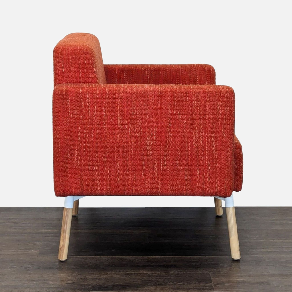 Modern HighTower lounge chair featuring bold fabric, sturdy wood legs, and comfortable wide armrests.