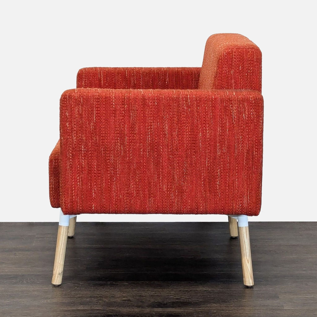 Contemporary lounge chair by HighTower, showcasing colorful fabric, durable build, and simple, clean lines.