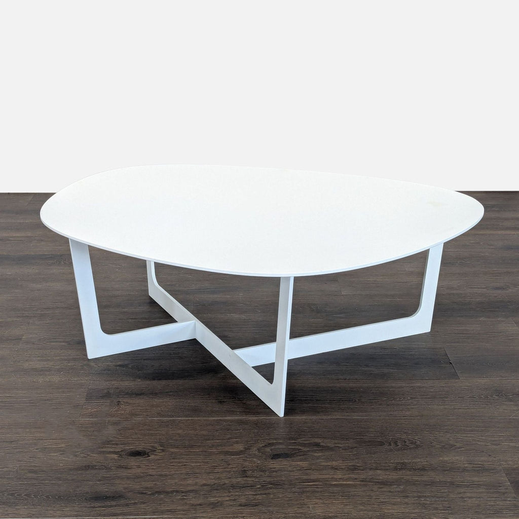 Modern Danish aluminum coffee table with a smooth, organic top and slender legs, produced by Jorgensen.  