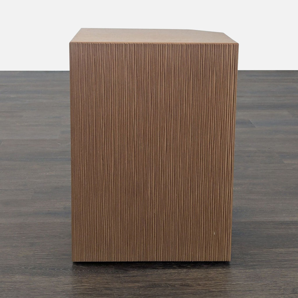 3. Coalesse side table with dimensional embossed wood surface, showcasing Norman Deikman’s angular modern design.