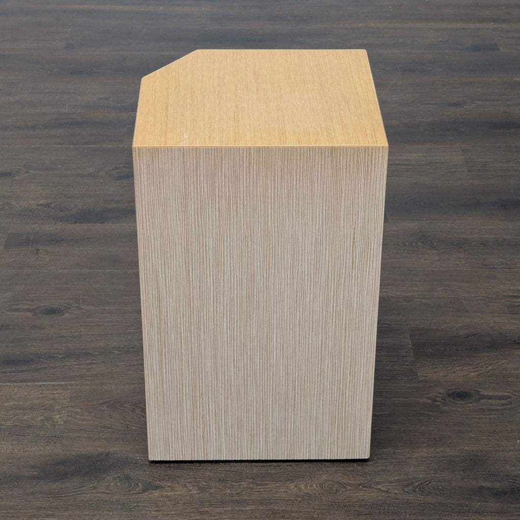 1. Embossed wood side table by Coalesse, showing a geometric cube shape with textured vertical lines.