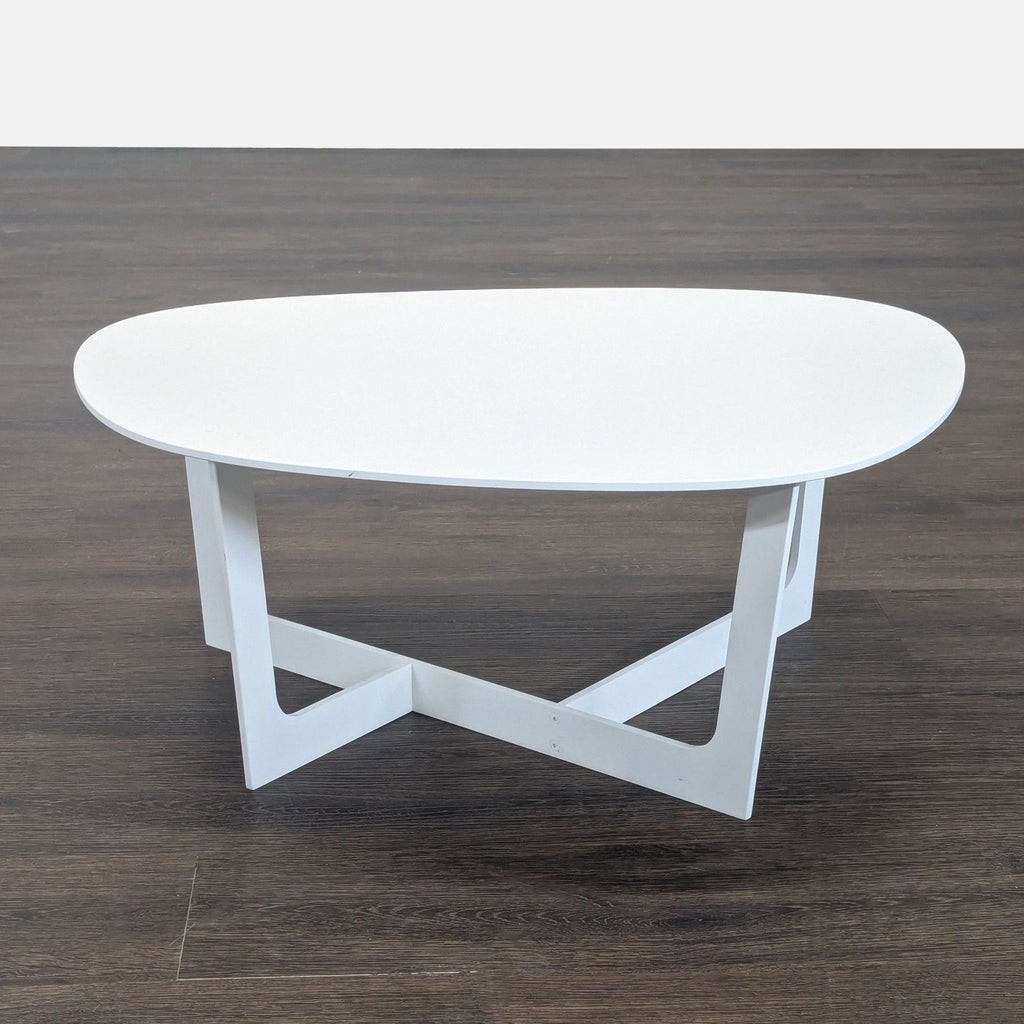 Modern Danish coffee table with rounded top and geometric base, made of aluminum by Jorgensen.