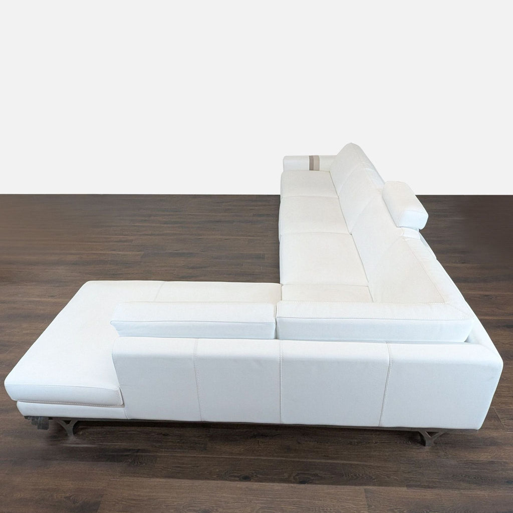3. Top-down side view of Roche Bobois sectional sofa, featuring white leather and spacious chaise lounge.
