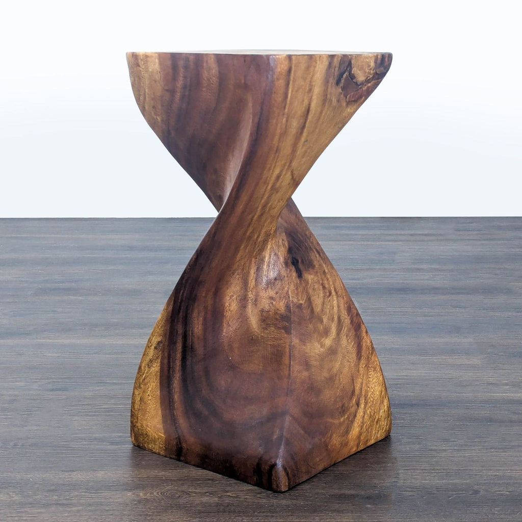 2. Solid wood end table featuring a unique hourglass twist shape and smooth, natural wood finish.