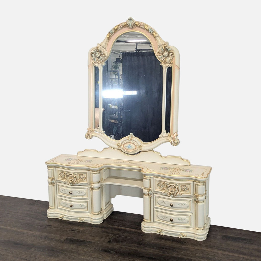 Charming vintage dresser with large detailed mirror, floral accents, and sturdy drawer storage in cream tones.