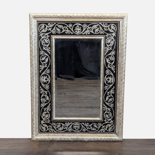 1. Rectangular mirror with an ornate black and silver floral frame, displayed upright on a wooden surface.
