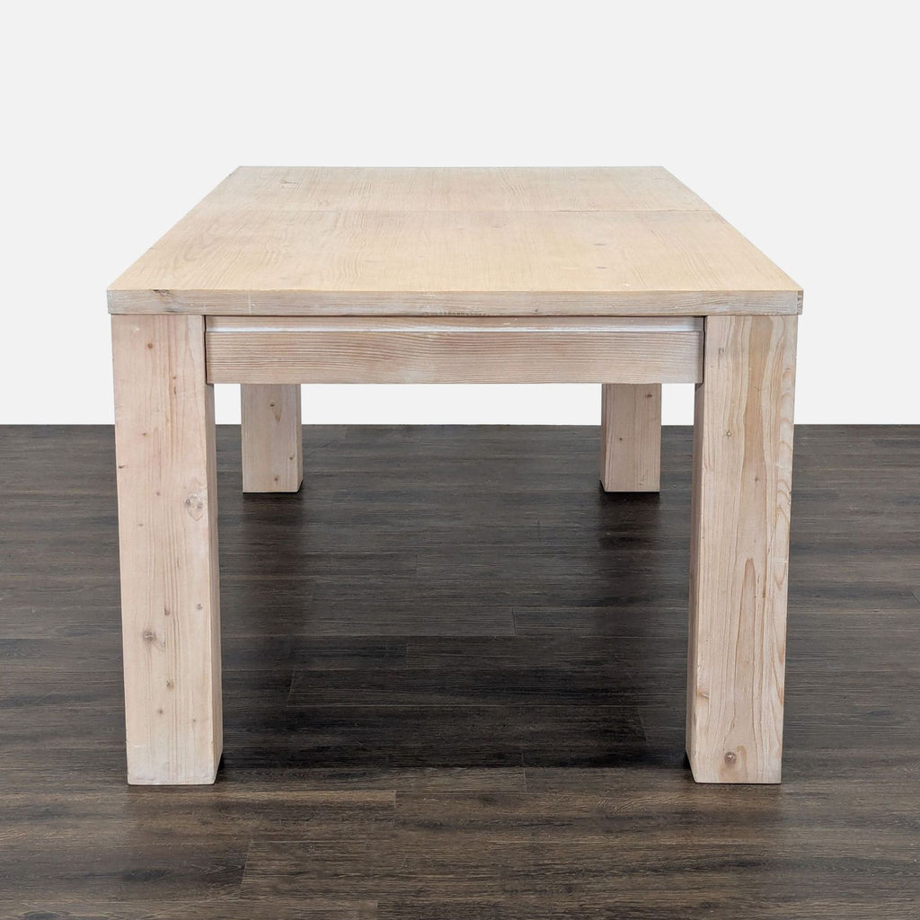 Desert Pine finish dining table by Pottery Barn, includes drawers and leaf to extend by 18 inches.