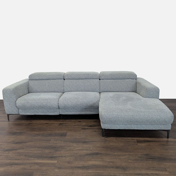 Gray Living Spaces sectional with chaise and power recliners, offering modern style and comfort for any home.