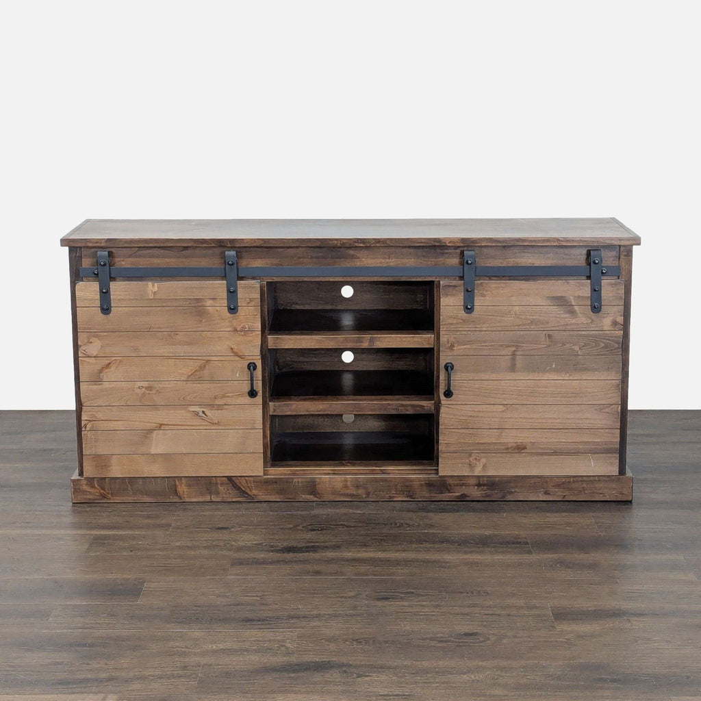 Aged whiskey-finished wood entertainment console with farmhouse sliding doors by Legends Furniture.  