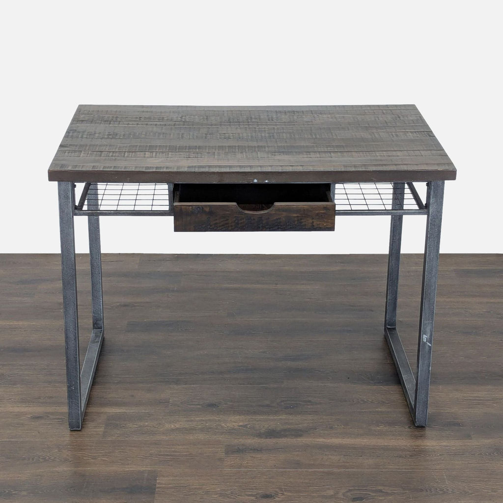 Standard Furniture desk with sleek metal legs, wood top, and storage drawer, ideal for workspace.