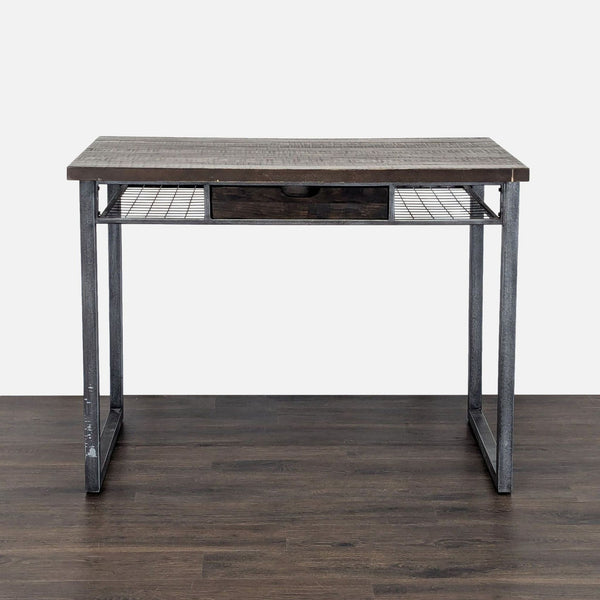 Industrial-style desk with a drawer, featuring a sturdy metal frame, by Standard Furniture.