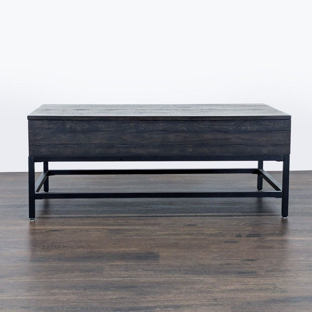 1. Rectangular dark wood and metal coffee table by Living Spaces, shown from the front on a wooden floor.